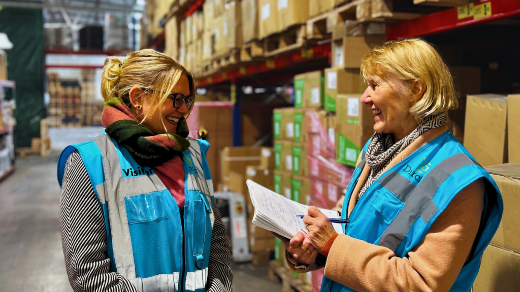 An assessor discusses her findings with a client being delivered a free energy assessment.